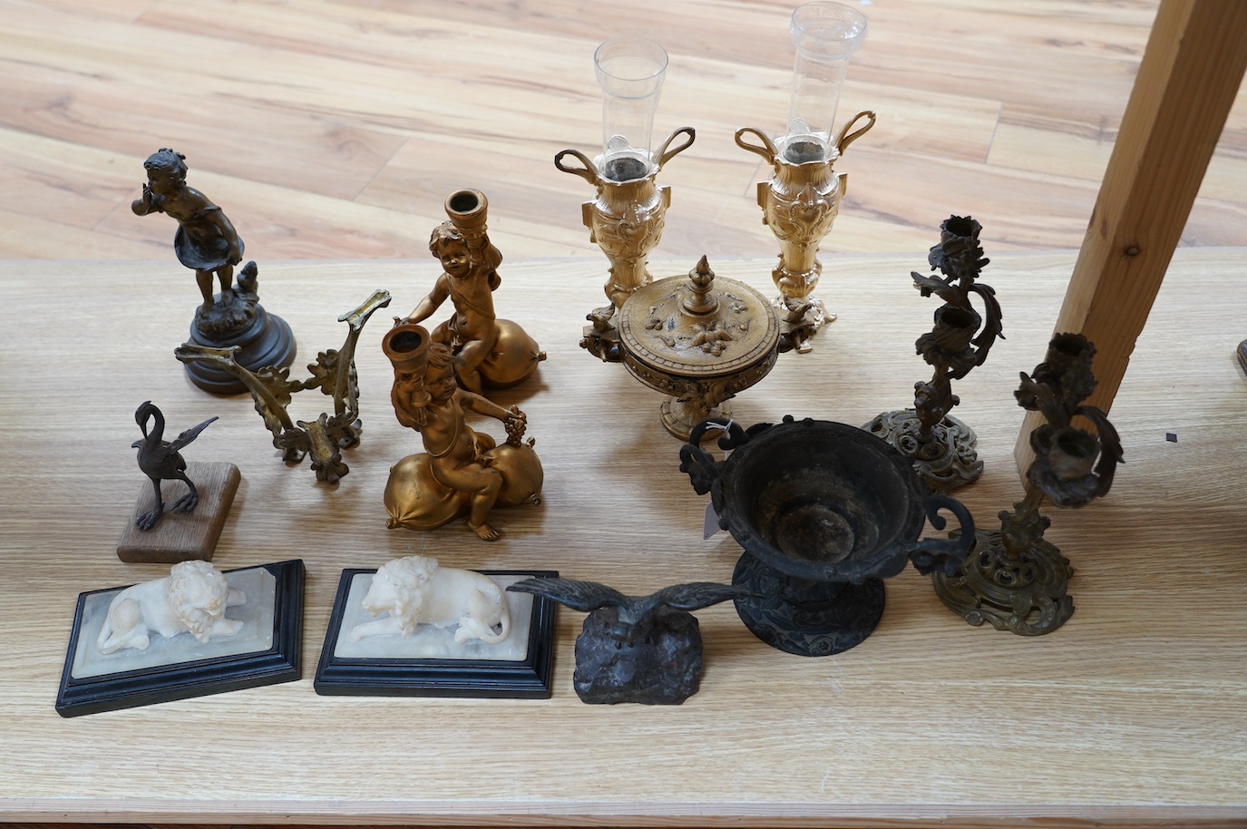 A group of mostly metalware, Victorian and later, including a pair of alabaster lions, resin cherubs, a cast metal tazza, a pair of cast candlesticks, etc. Condition - poor to fair